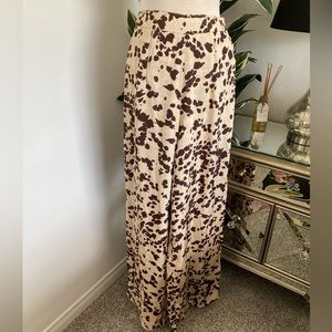 Nasty Gal light weight high waisted cow hide pattern trousers. Size US 4
